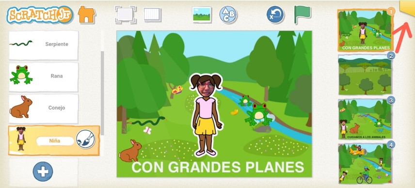 Interfaz de Scratch Jr. con una flecha señalando una pestaña amarilla en la parte superior derecha.